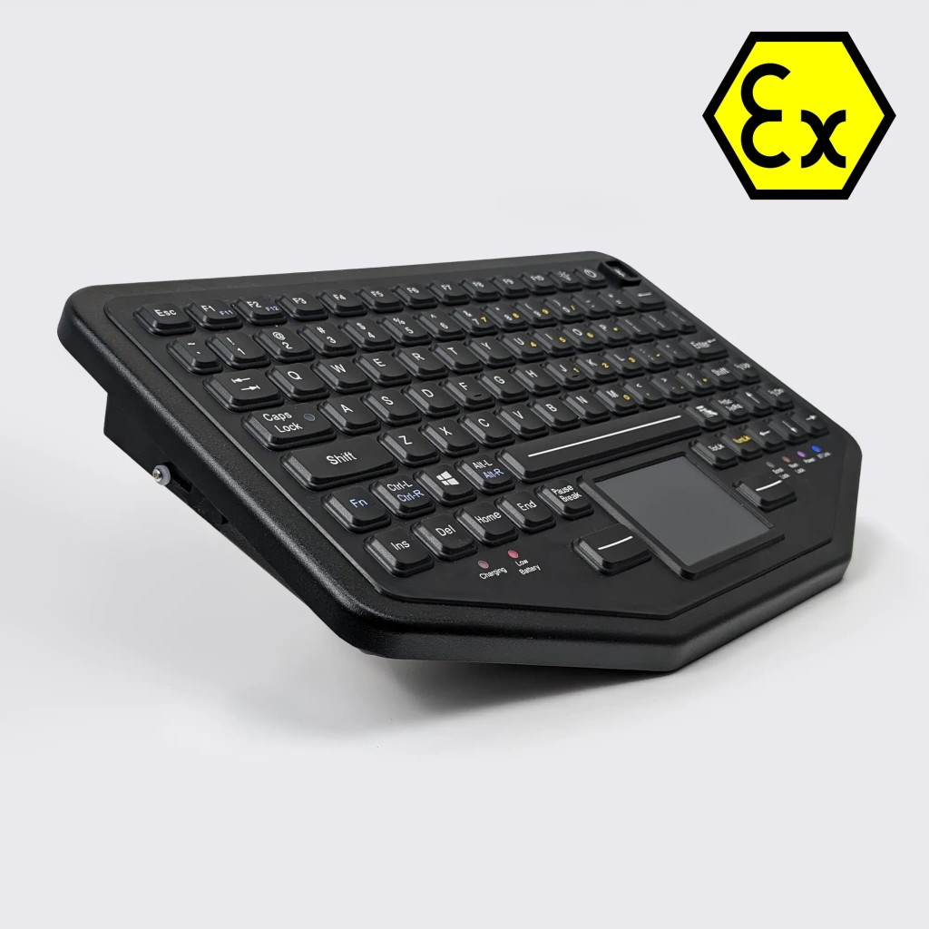 Ex keyboard, all black, rugged, sturdy, shown from the side, in the top of the image is an ex logo sticker